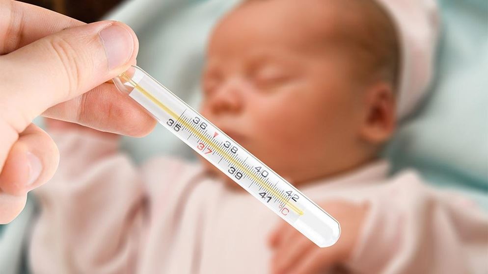 new-born-baby-with-thermometer